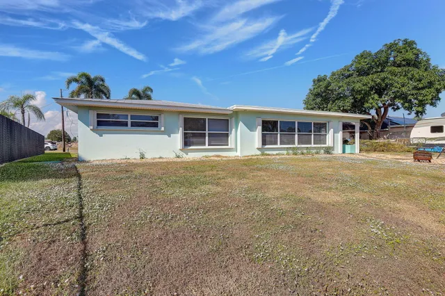 a house with trees in the background