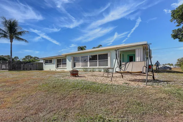 a house view with a backyard space