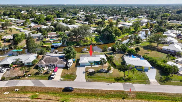 an aerial view of residential houses with outdoor space