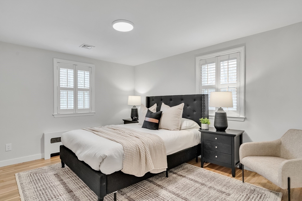 544 Pearl Street Reading, MA 01867 - Photo 13 of 24 a bedroom with bed and a window