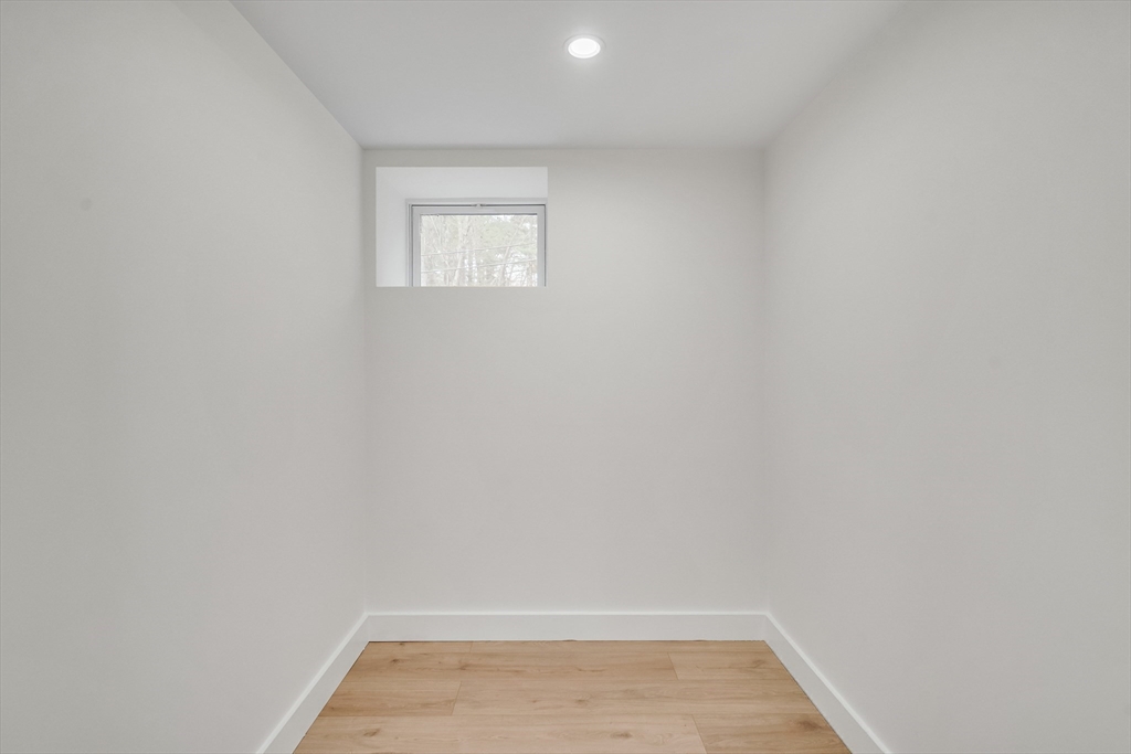 544 Pearl Street Reading, MA 01867 - Photo 18 of 24 a view of a small space with wooden floor and a window