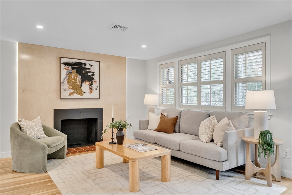 544 Pearl Street Reading, MA 01867 - Photo 2 of 24 a living room with furniture and a fireplace