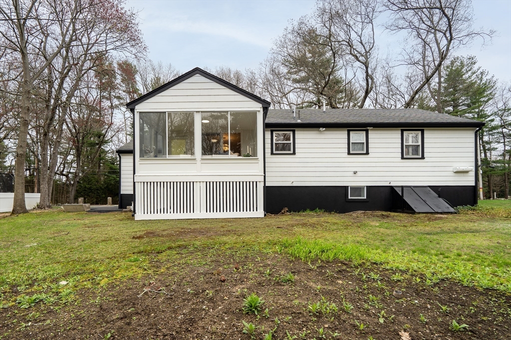 544 Pearl Street Reading, MA 01867 - Photo 23 of 24 a front view of a house with a yard and porch