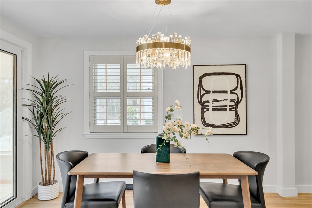 544 Pearl Street Reading, MA 01867 - Photo 7 of 24 a view of a dining room with furniture window and wooden floor