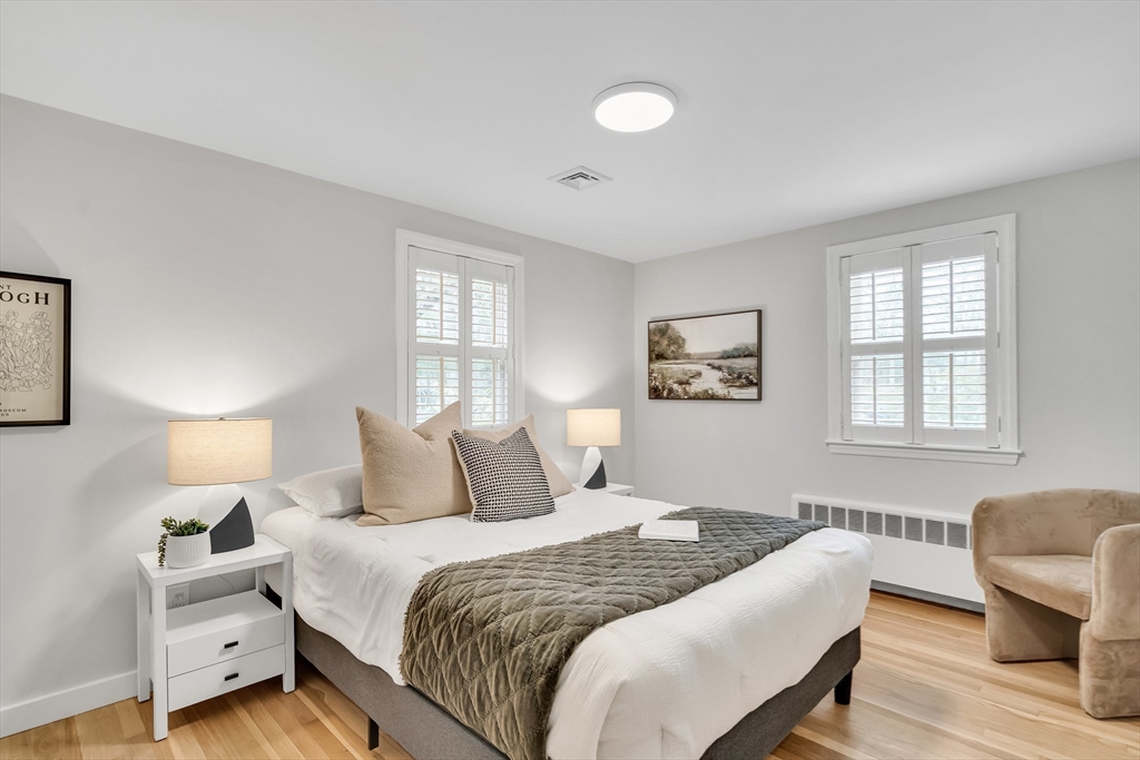 544 Pearl Street Reading, MA 01867 - Photo 10 of 24 a bedroom with a bed and a couch