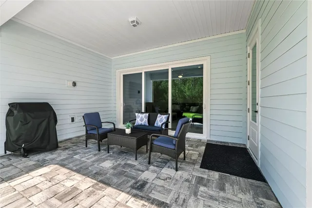 a view of a swimming pool with lawn chairs