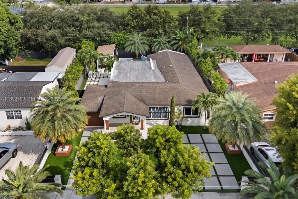 155 West 60th Street Hialeah, FL 33012 - Photo 23 of 29 an aerial view of multiple houses with yard