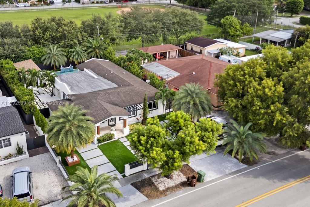 155 West 60th Street Hialeah, FL 33012 - Photo 24 of 29 an aerial view of multiple houses with yard