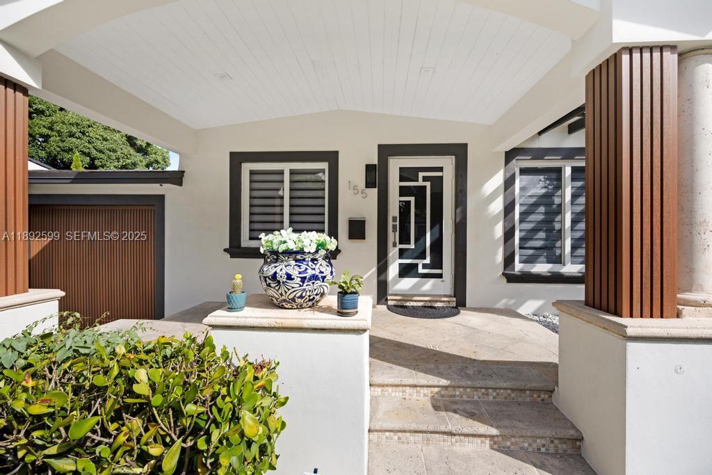 155 West 60th Street Hialeah, FL 33012 - Photo 27 of 29 a front view of a house with garden