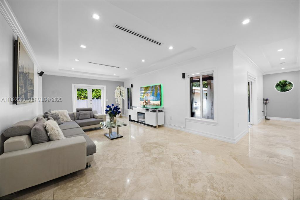 155 West 60th Street Hialeah, FL 33012 - Photo 3 of 29 a living room with furniture and a wooden floor