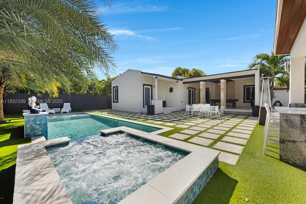 155 West 60th Street Hialeah, FL 33012 - Photo 4 of 29 a view of a house with swimming pool and yard