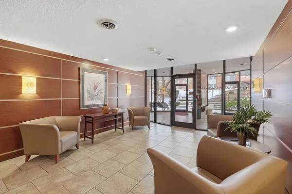 a view of a swimming pool with a yard and wooden fence