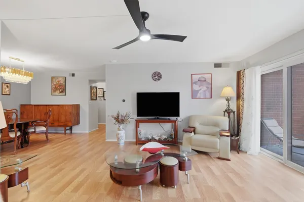 a view of a livingroom with furniture and a hallway
