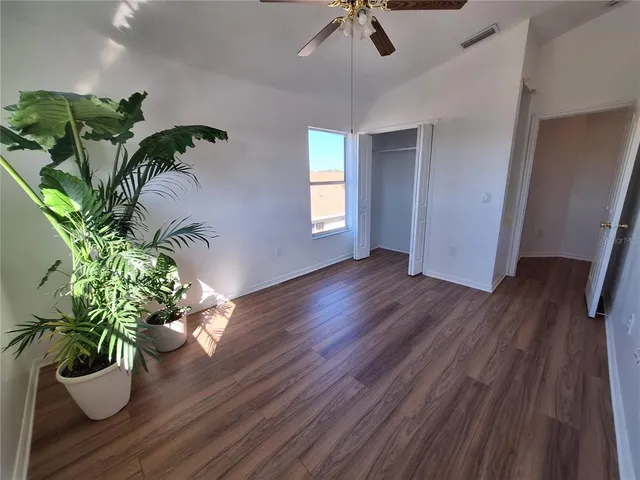a view of a vase with flowers on a table