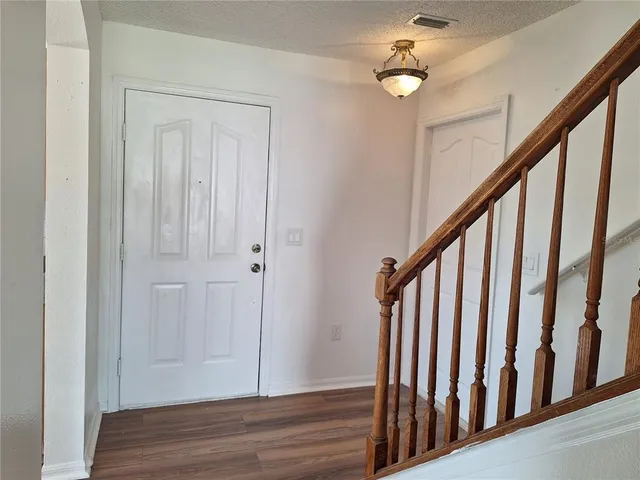 a view of a dining room with wooden floor