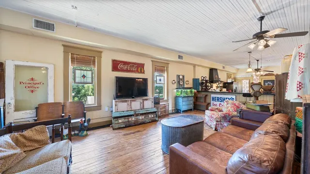 a living room with furniture and a flat screen tv