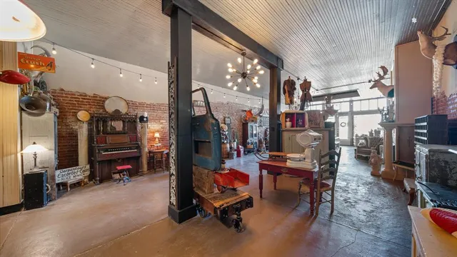 a view of a chairs and tables in the living room