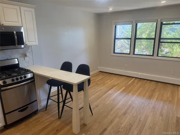 a view of a livingroom with furniture and a flat screen tv