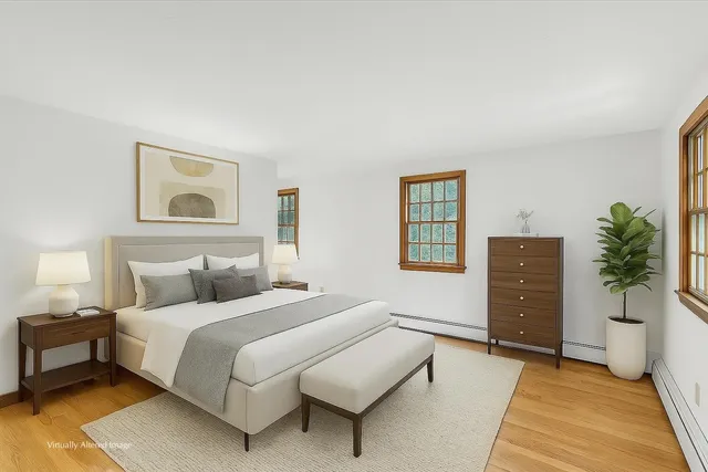 a view of empty room with a fireplace and window