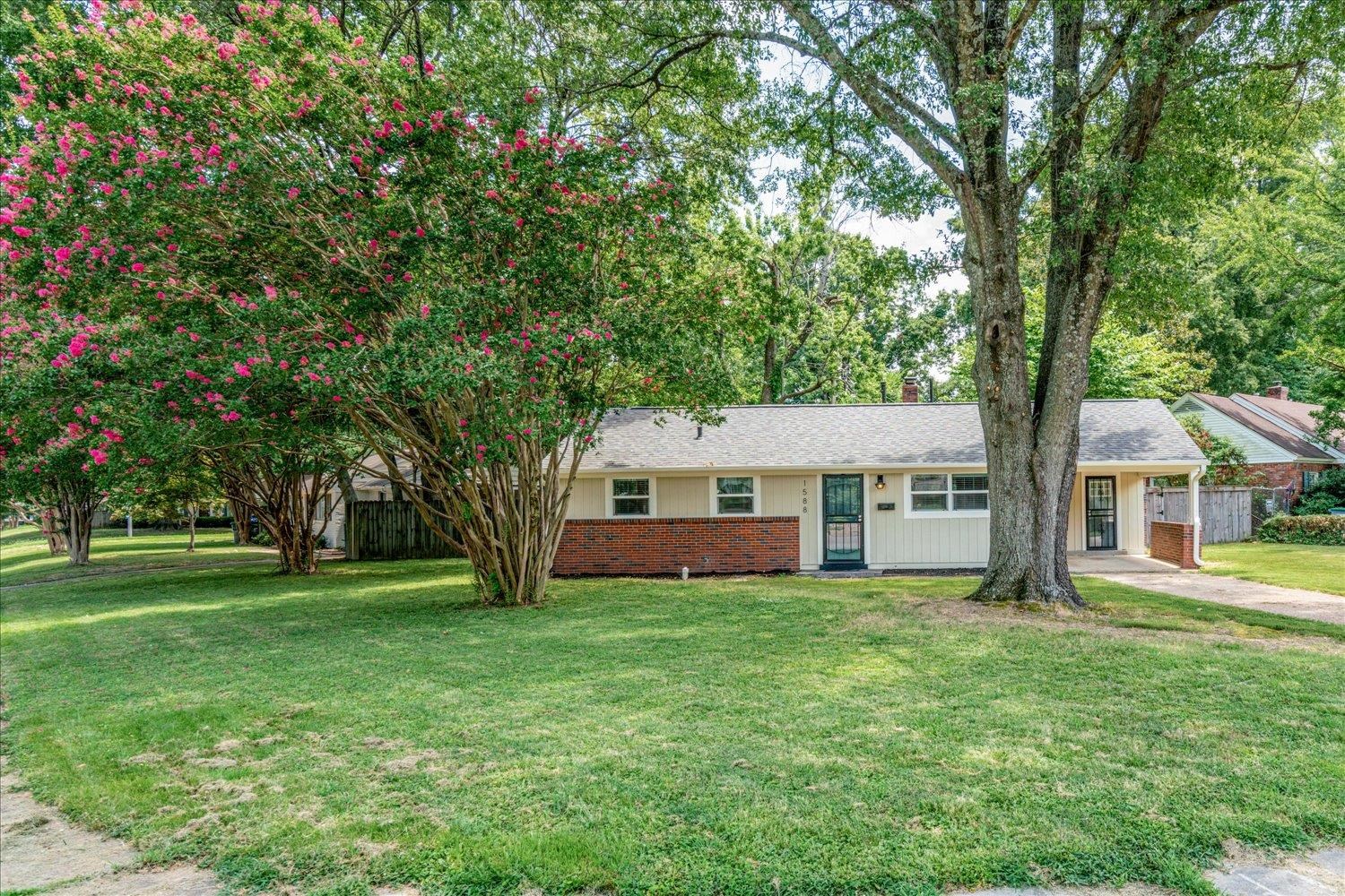 1588 Colonial Road Memphis, TN 38117 - Photo 3 of 35 a front view of house with yard and green space
