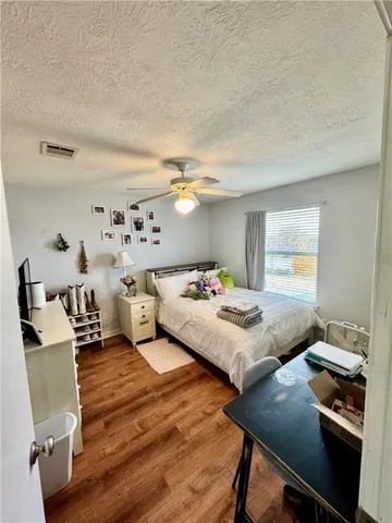 a bedroom with a bed and a table in it