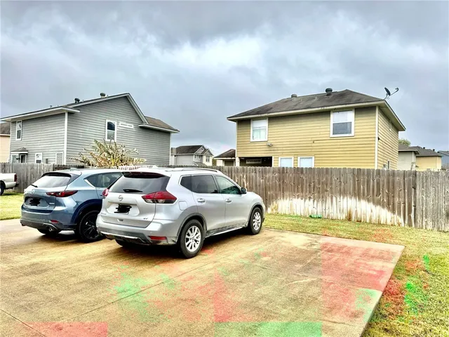 a car parked in front of a house