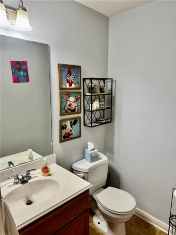 a white toilet sitting next to a bathroom sink