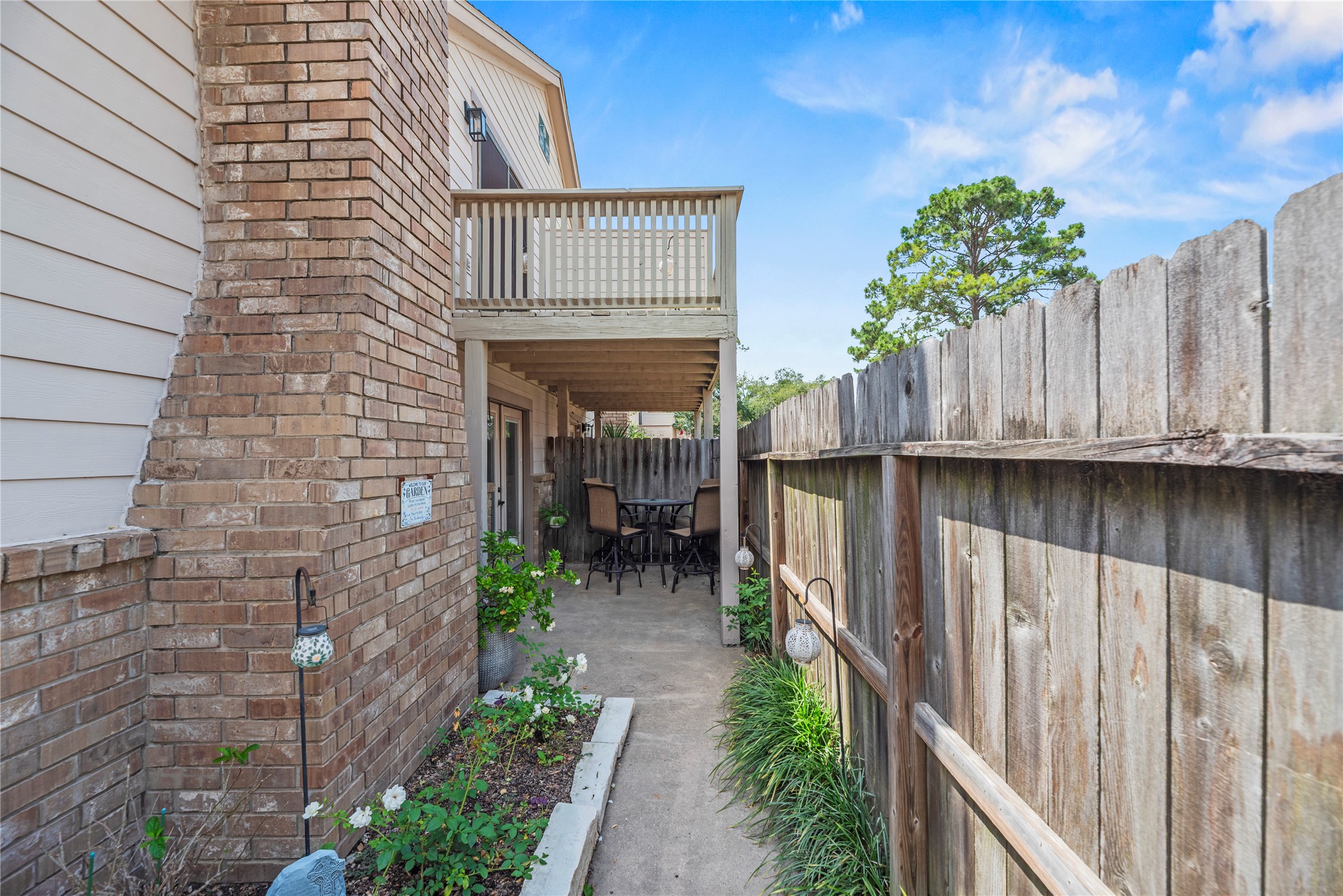 16913 Chapel Pines Drive, Unit 126 Spring, TX 77379 - Photo 26 of 27 Covered outdoor patio area right outside the breakfast area. Including your own rose garden!