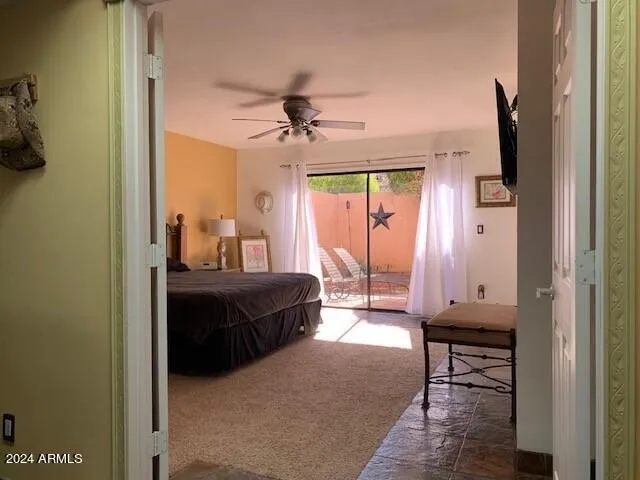 a living room with a bed furniture and a window