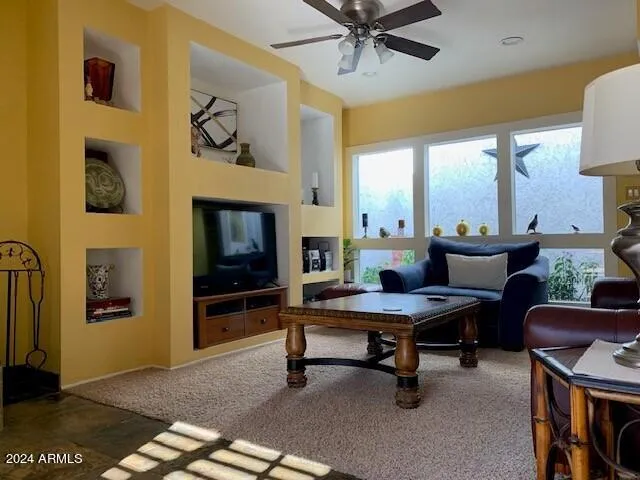 a view of a livingroom with furniture and a fireplace