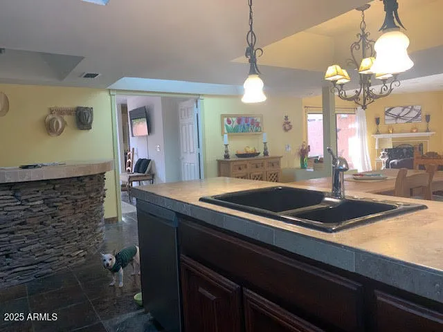 a kitchen with a sink and cabinets
