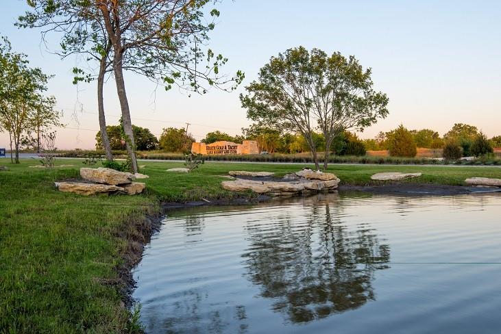 2715 Triumph Court Heath, TX 75126 - Photo 25 of 30 a view of a lake with houses in background
