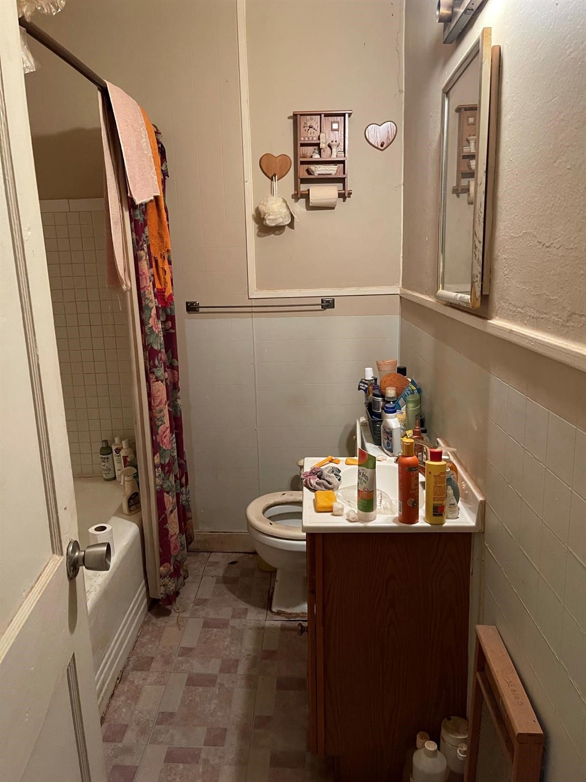6815 Goforth Street Houston, TX 77021 - Photo 3 of 12 a bathroom with a sink a toilet and mirror