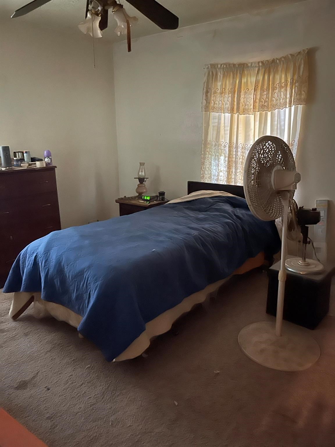 6815 Goforth Street Houston, TX 77021 - Photo 4 of 12 a bedroom with a bed and window