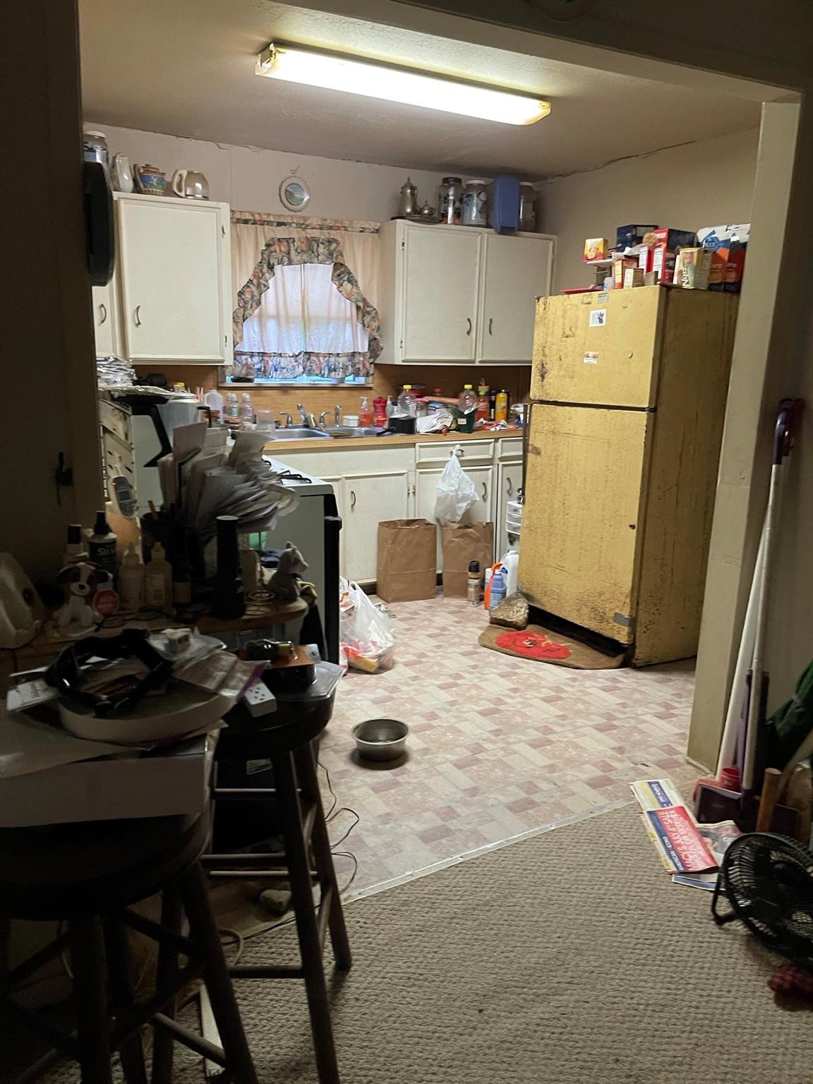6815 Goforth Street Houston, TX 77021 - Photo 5 of 12 a kitchen with a sink a stove and a refrigerator