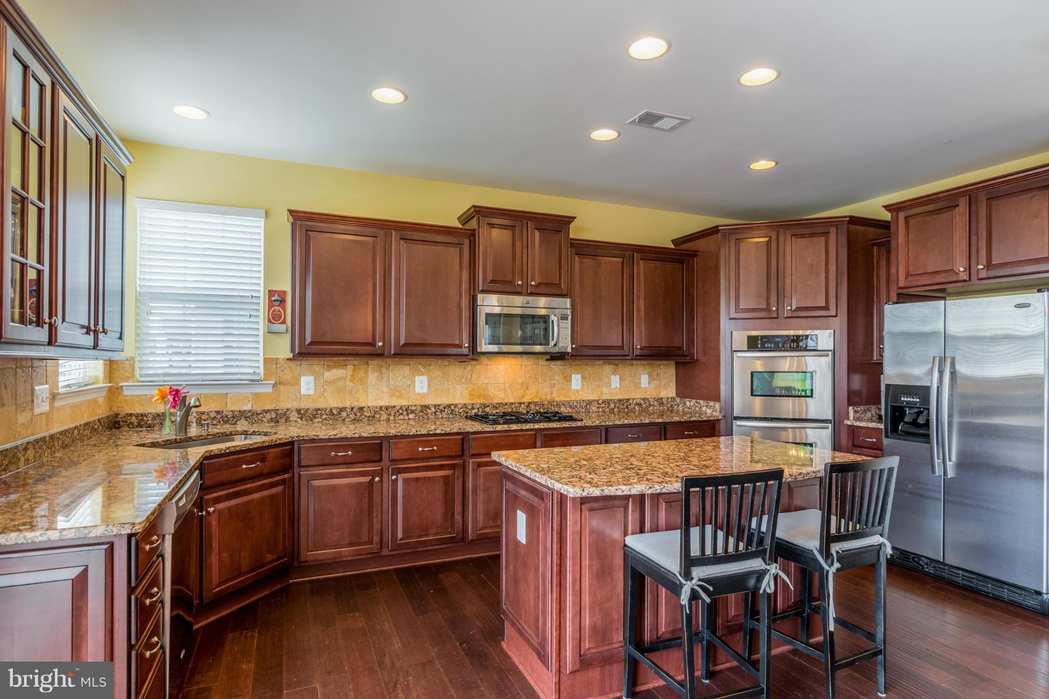 6705 Pebble Brooke Road Baltimore, MD 21209 - Photo 7 of 30 KITCHEN W/ STAINLESS APPLIANCES