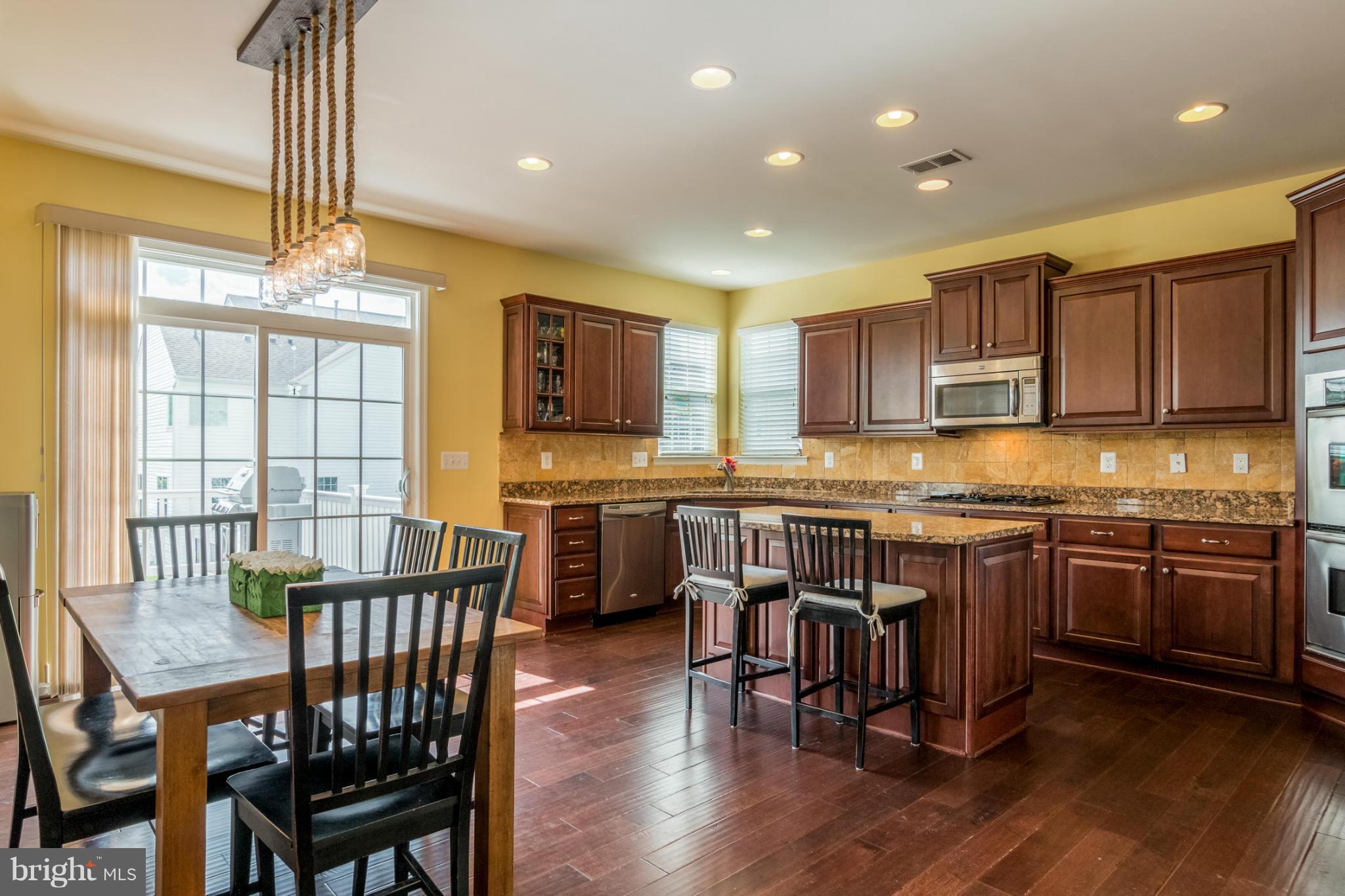 6705 Pebble Brooke Road Baltimore, MD 21209 - Photo 9 of 30 KITCHEN W/ SLIDERS TO DECK