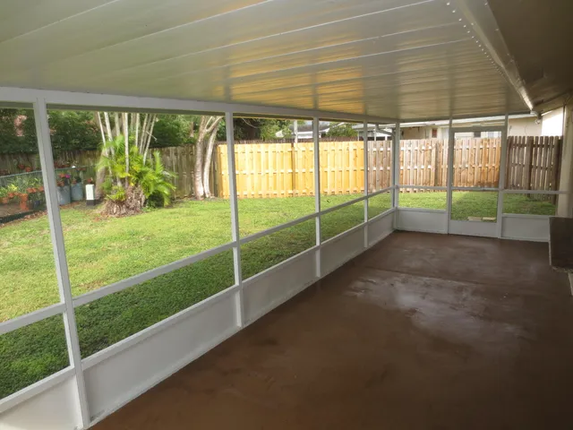 a view of a room with yard from a ceiling fan