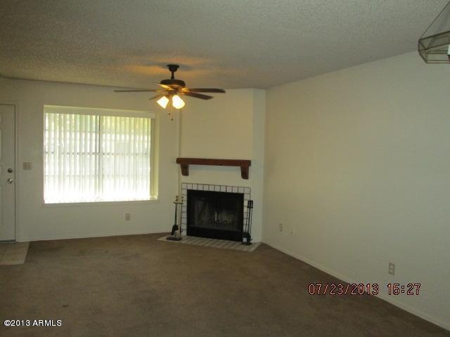 7905 West Thunderbird Road, Unit 300 Peoria, AZ 85381 - Photo 3 of 10 Fireplace in Living Room