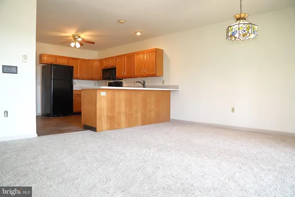 an empty room with a fireplace