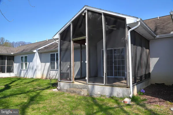 a view of house with backyard