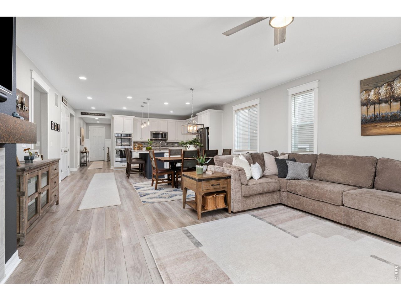 1122 Gabriella Lane Berthoud, CO 80513 - Photo 11 of 33 a living room with furniture and a wooden floor