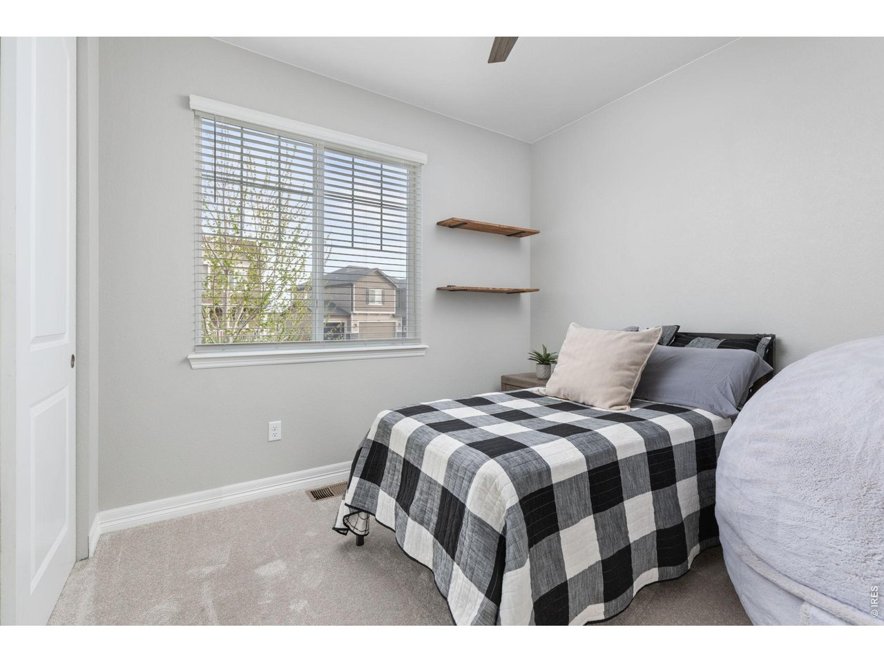 1122 Gabriella Lane Berthoud, CO 80513 - Photo 16 of 33 a bedroom with a bed and a window