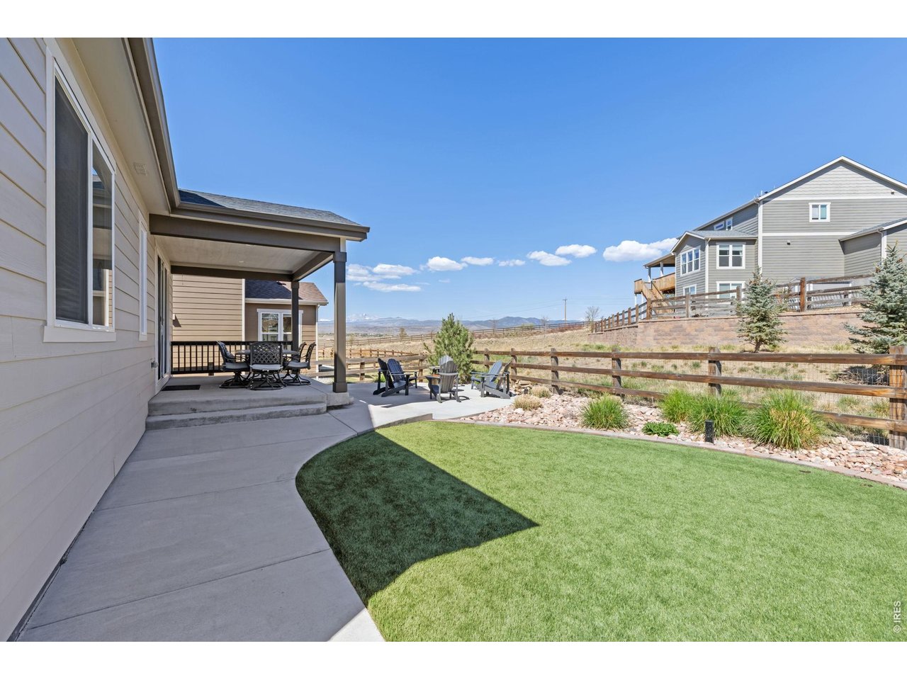 1122 Gabriella Lane Berthoud, CO 80513 - Photo 26 of 33 a view of a house with a yard porch and sitting area