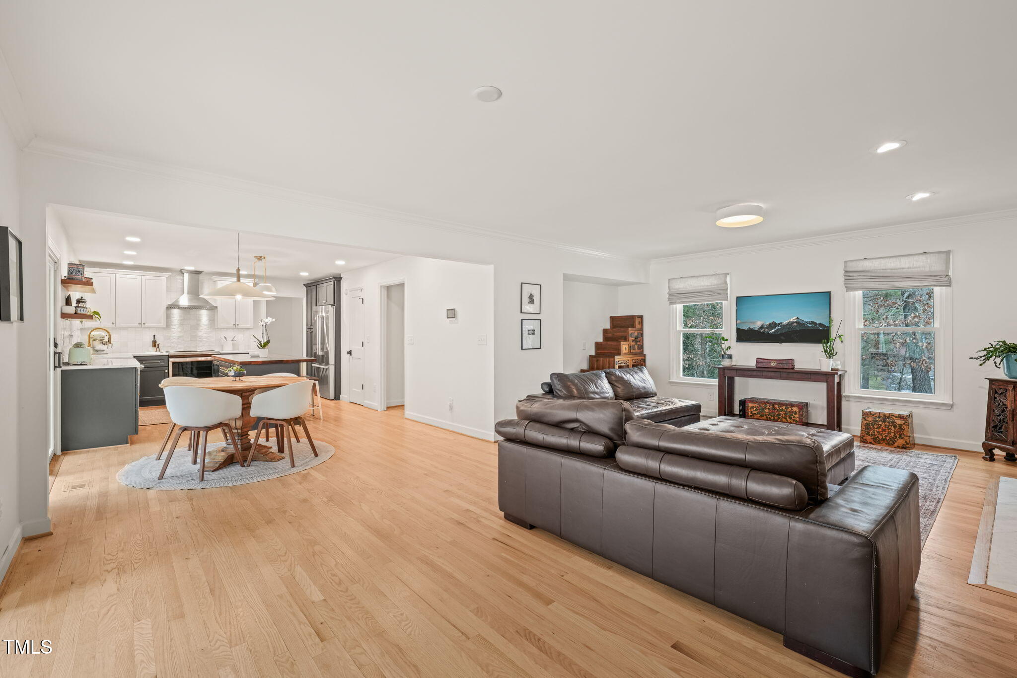 4714 Highgate Drive Durham, NC 27713 - Photo 8 of 50 a living room with furniture and a wooden floor