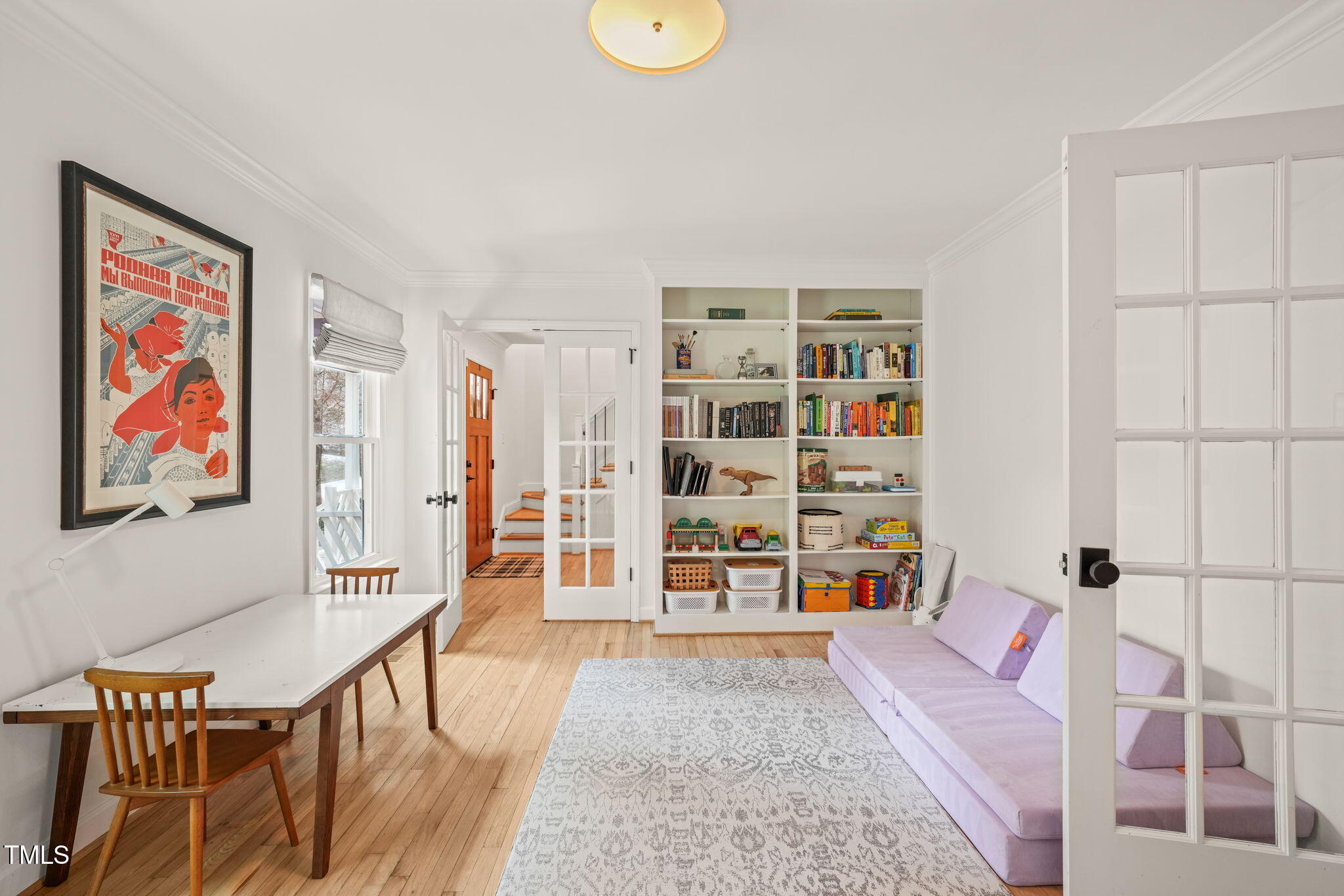 4714 Highgate Drive Durham, NC 27713 - Photo 9 of 50 a living room with furniture cabinets and wooden floor