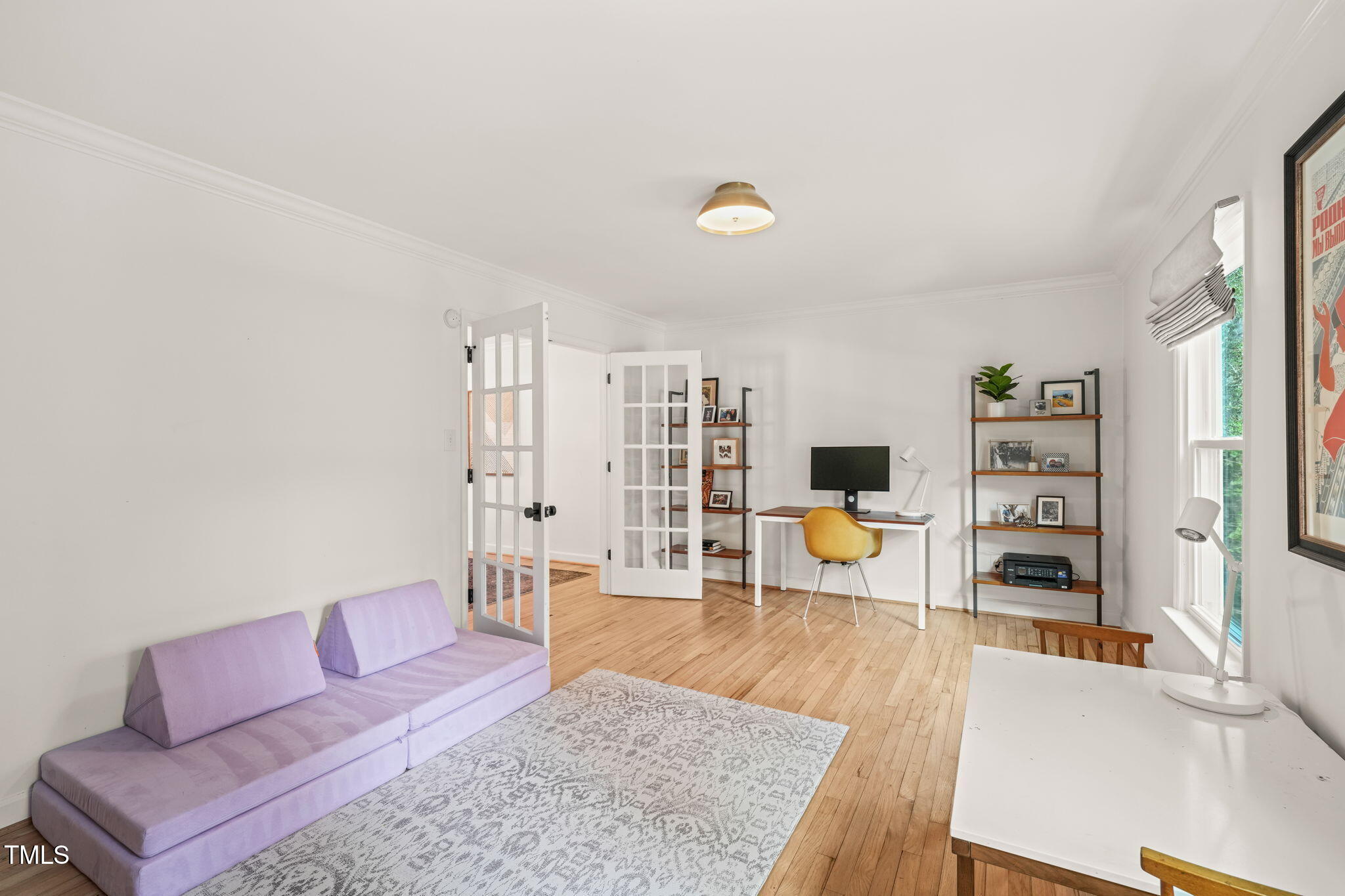 4714 Highgate Drive Durham, NC 27713 - Photo 10 of 50 a living room with furniture and a wooden floor