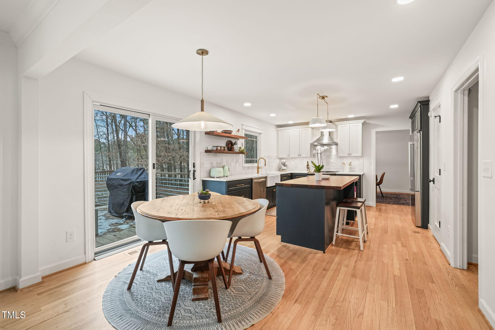 4714 Highgate Drive Durham, NC 27713 - Photo 13 of 50 a view of a dining room with furniture window and wooden floor
