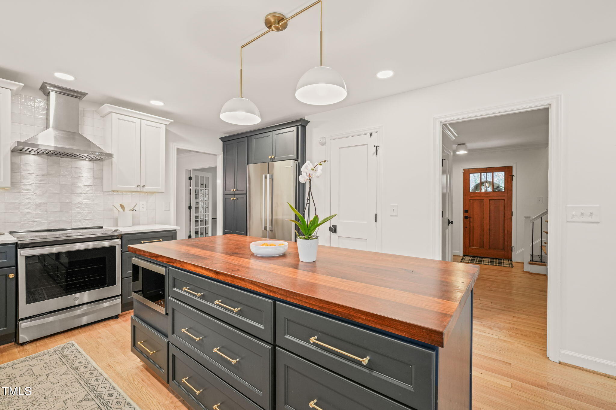 4714 Highgate Drive Durham, NC 27713 - Photo 16 of 50 a kitchen with a sink and stainless steel appliances