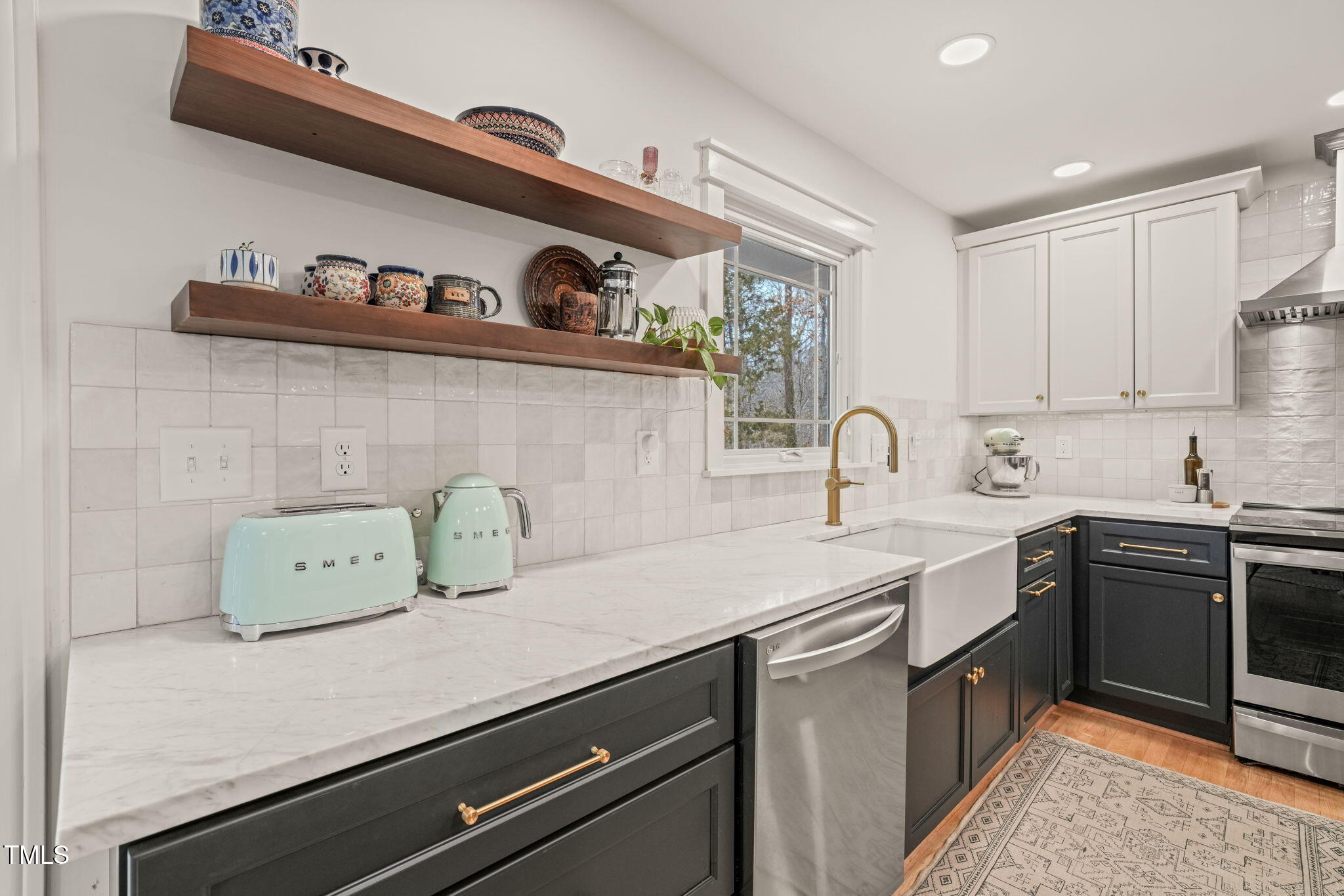 4714 Highgate Drive Durham, NC 27713 - Photo 17 of 50 a kitchen with a sink and cabinets